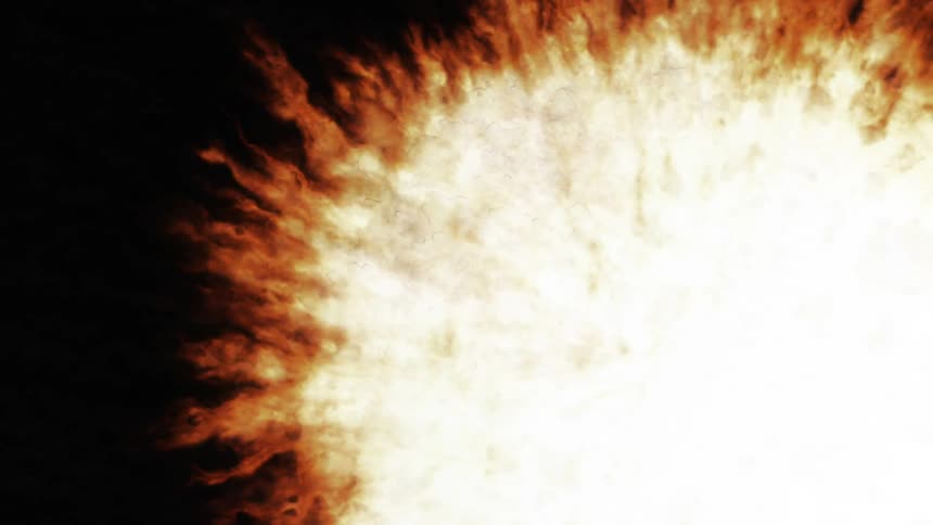 An explosive white light against a black backdrop