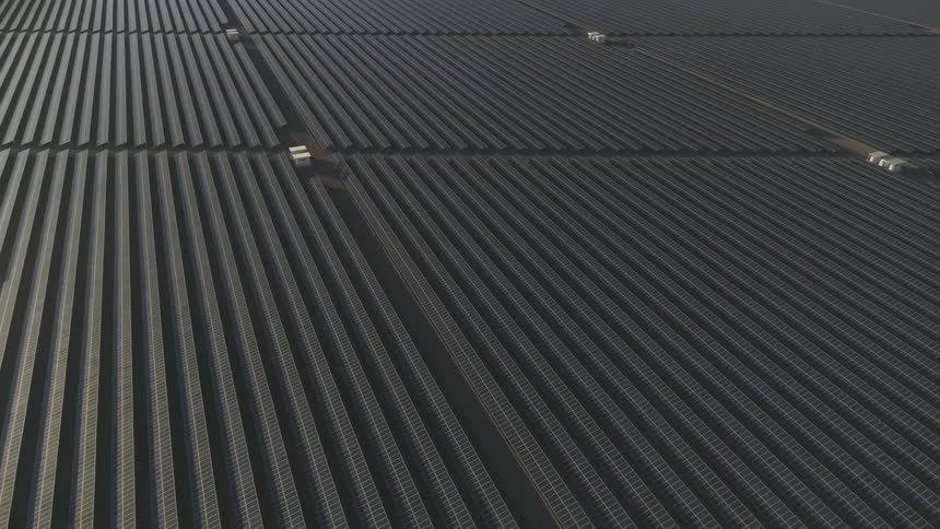 Hundreds of thousands of solar panels in a gigantic field
