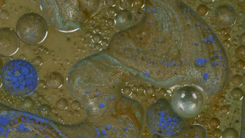 The different paint colors mix together in the pool
