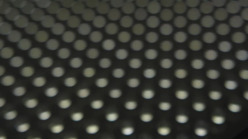 The dots are all lined up under the light