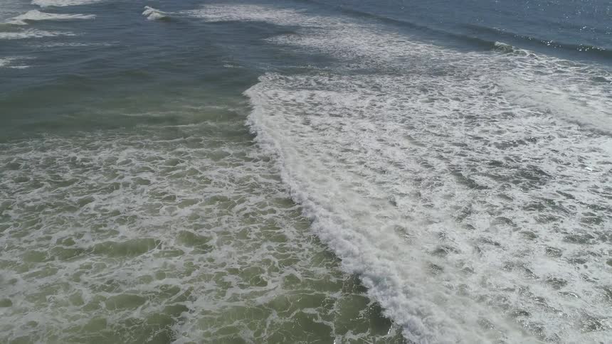 The waves slowly hit the shore