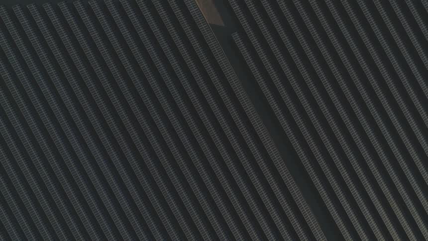 Rows of solar panels in a solar farm