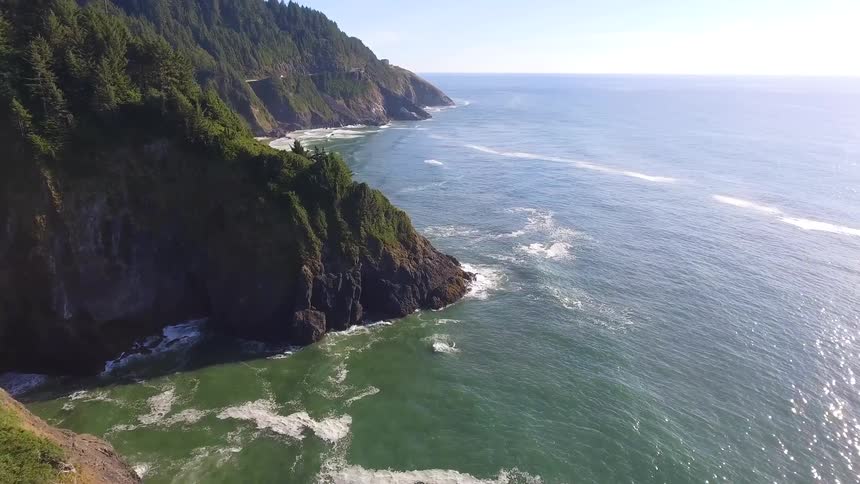 Ocean waves crash into a shoreline