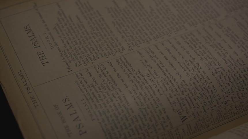 The light slowly dims on the book pages