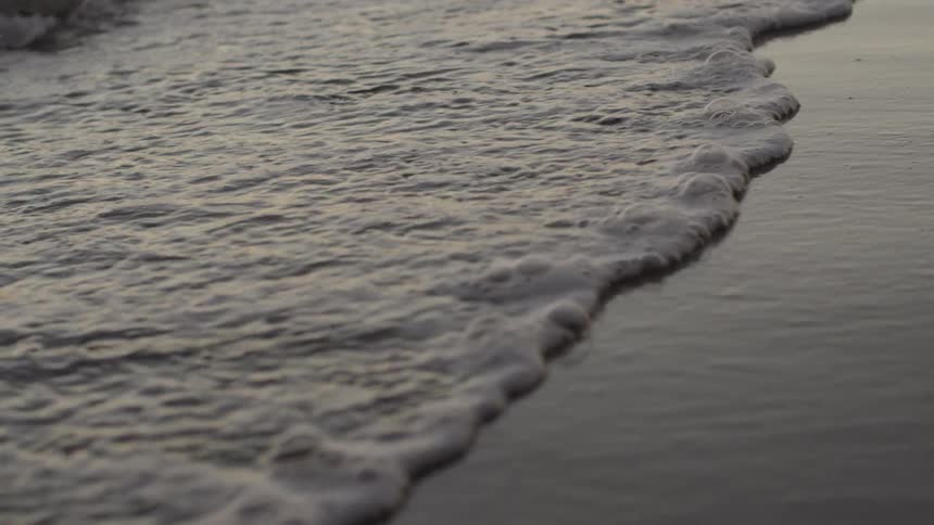 Waves crashing against the beach