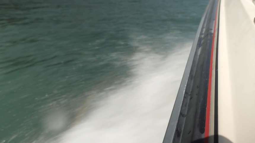 Man Driving Boat Around Lake
