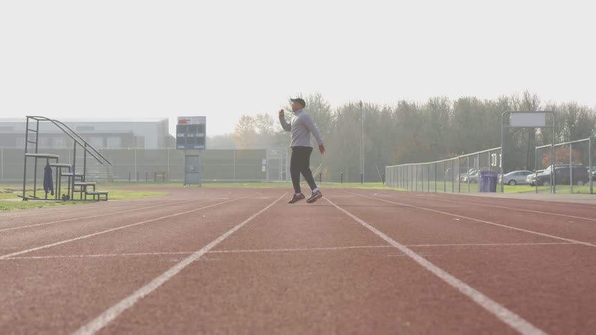 Man Exercising At Stadium