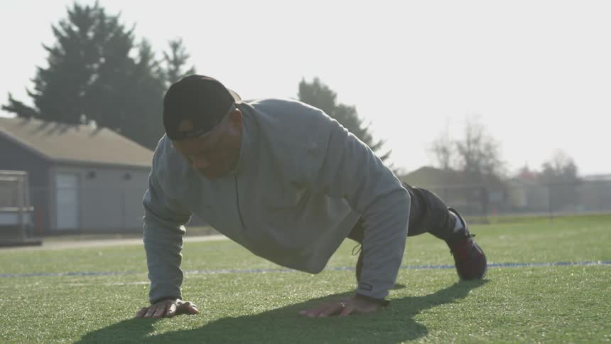 Man Exercising At Stadium