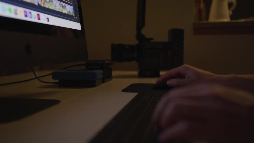 Man Editing Footage At Night