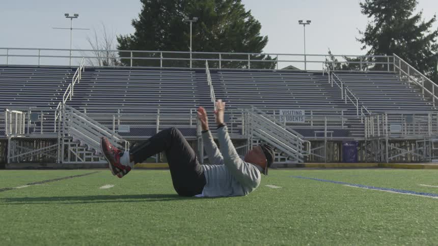 Man Exercising At Stadium