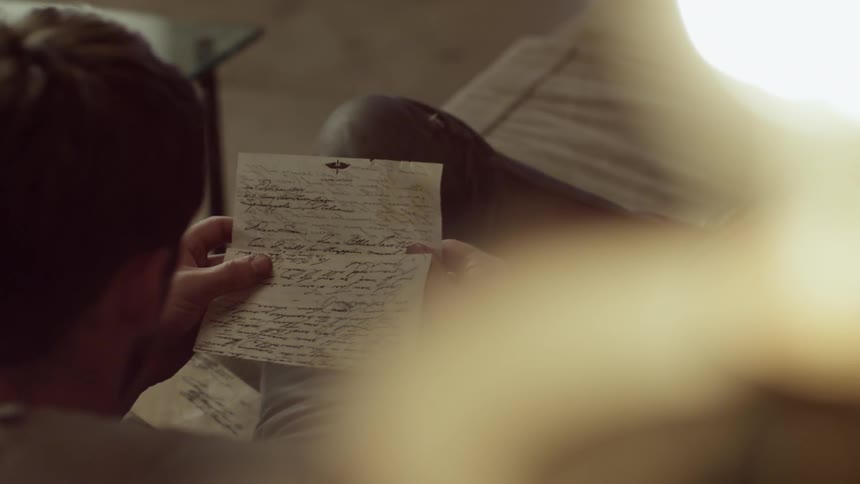A person reading a letter