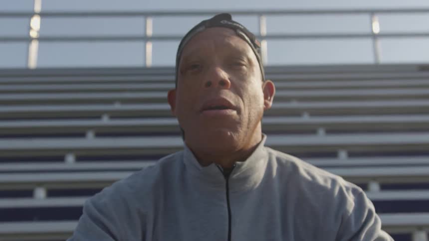 Man Exercising At Stadium