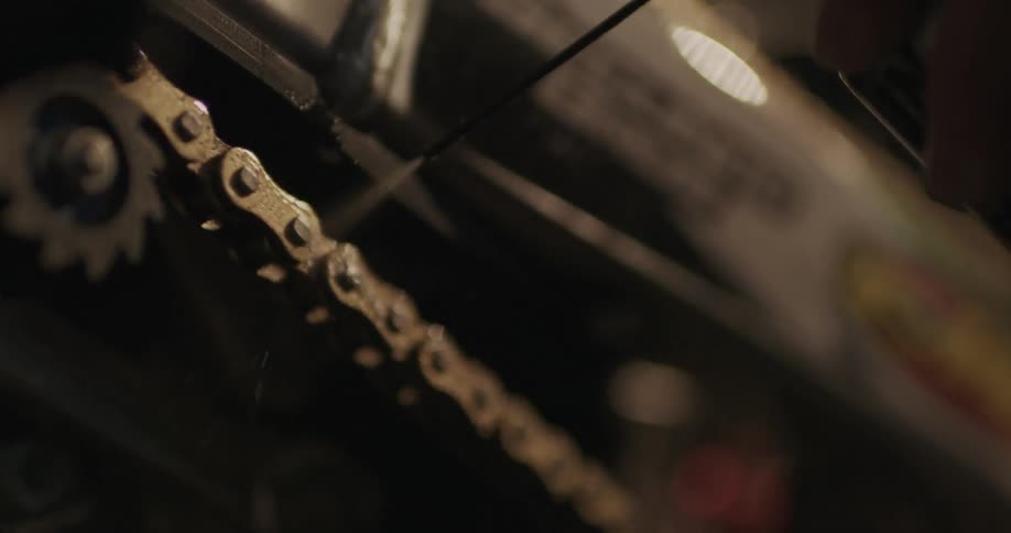 Close up of a bike chain slowly moving