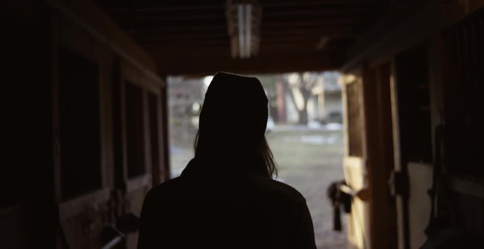 A person walking down a hallway
