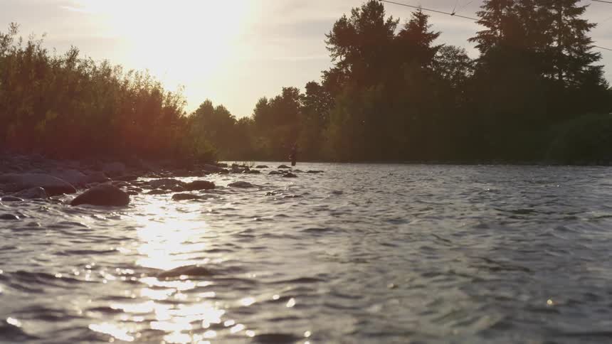 A person is in the water fishing