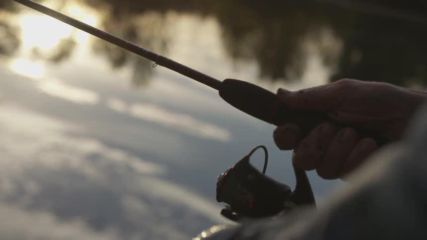 White man fishing at the lake