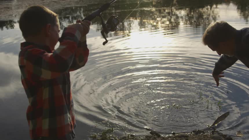 Father and son are fishing together