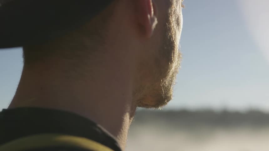 A man looking into the distance in the desert
