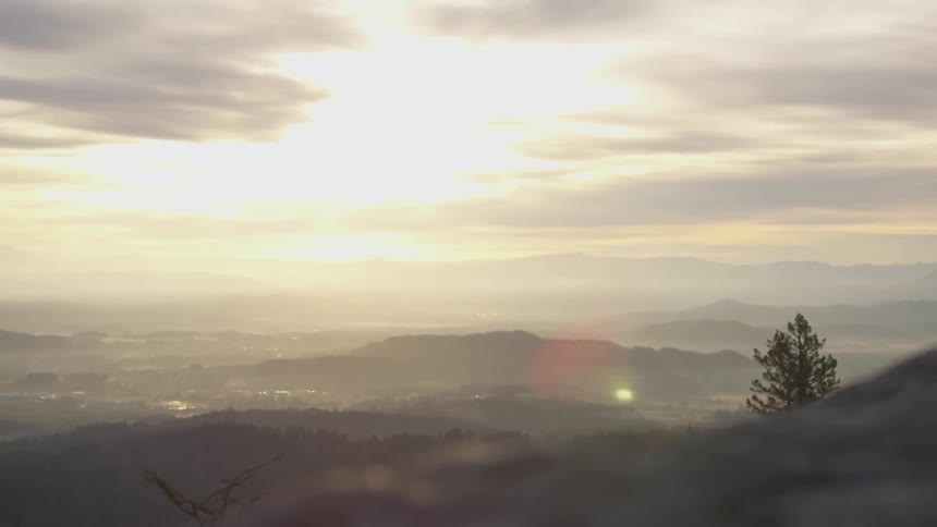 Landscape of mountains and valleys in sunlight
