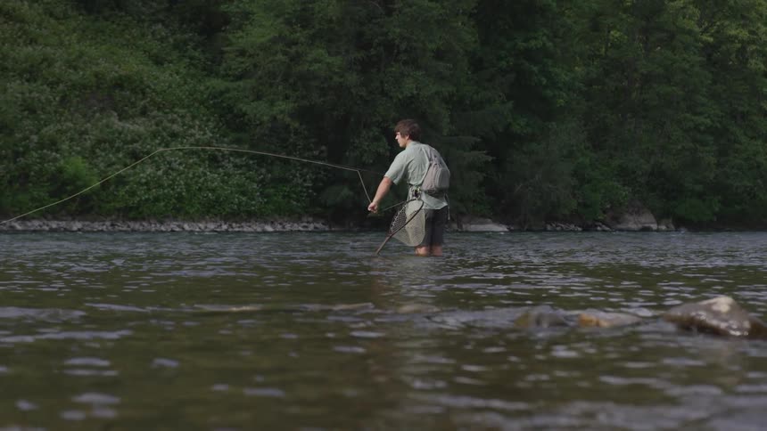 Man Fishing In The River