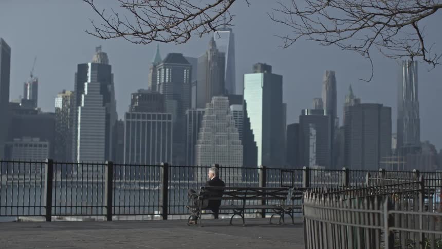 A person sitting on a city bench
