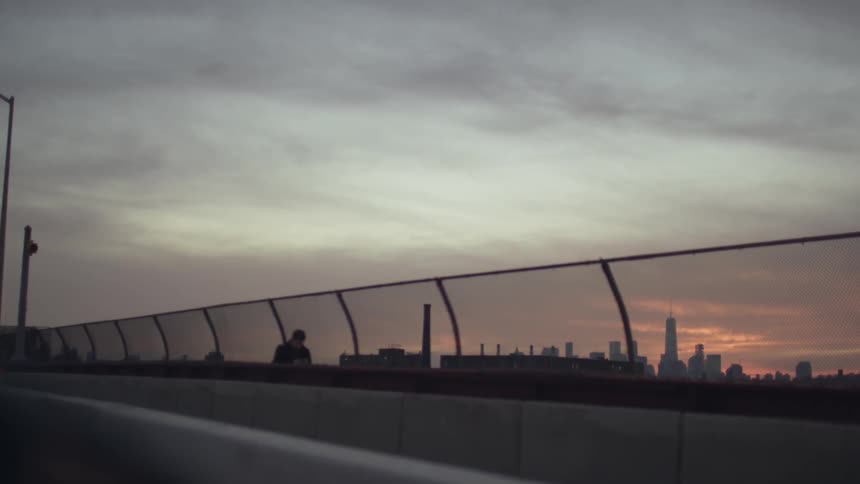 Walkway on a road as one man passes on a cloudy day