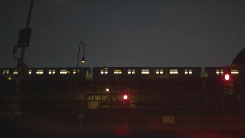 A train passing thru a city at night