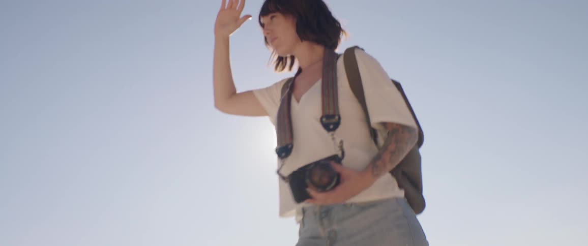 Woman Taking Photos And Exploring Overlook