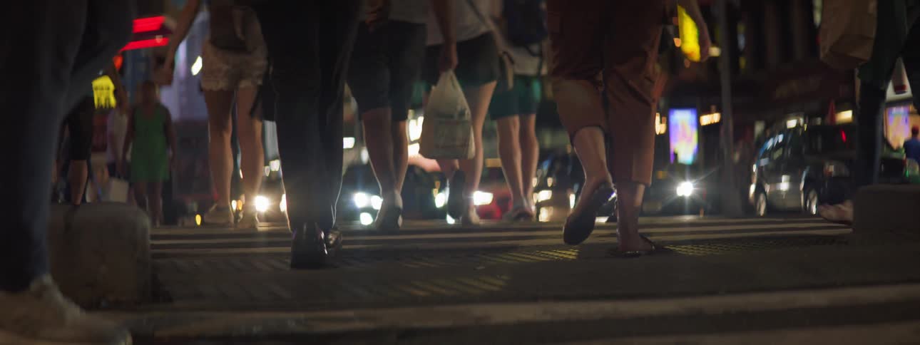 Group of people walking across the street