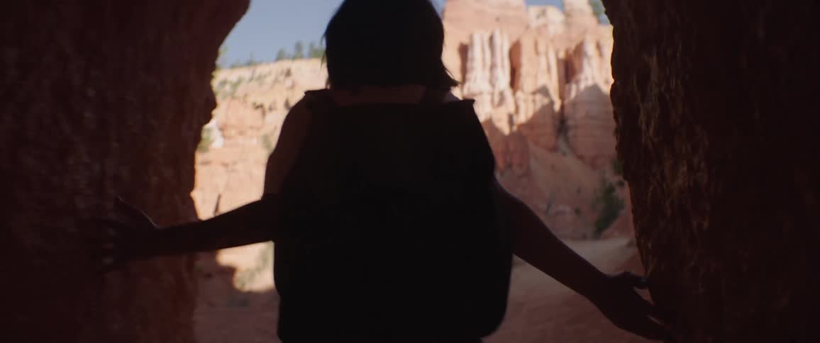 Woman Taking Photos And Exploring Overlook