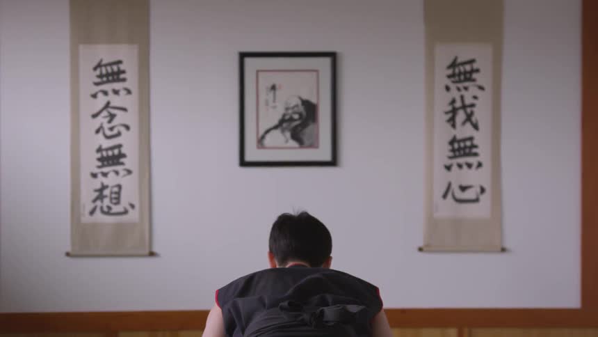 Man Practicing Asian Fighting Techniques