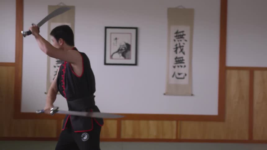 Man Practicing Asian Fighting Techniques