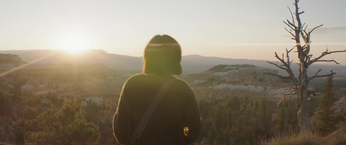 Woman Taking Photos And Exploring Overlook