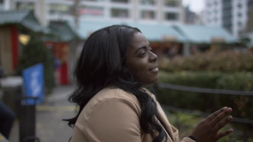 A woman talking to someone across from her