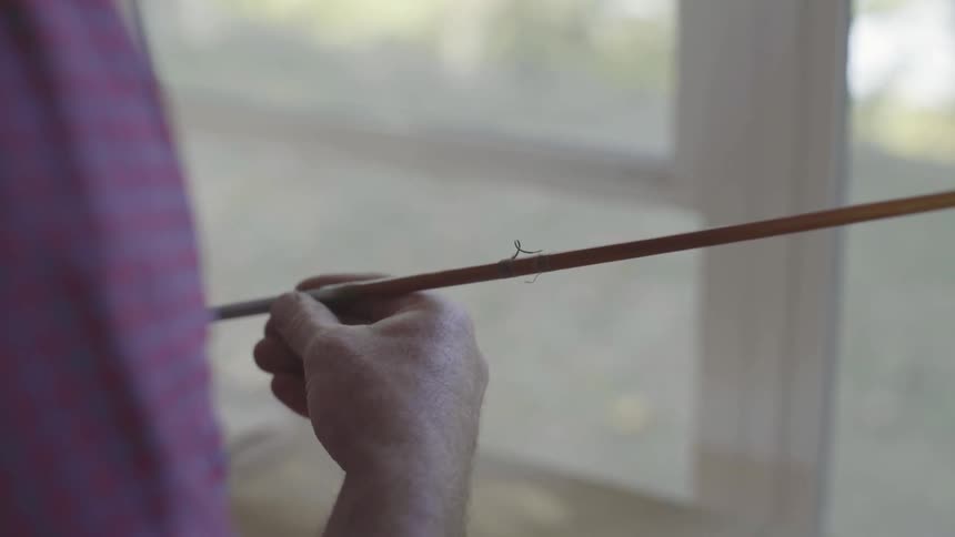 Man Making Fishing Pole