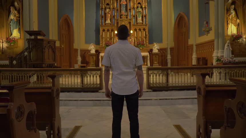 Man Praying At Church