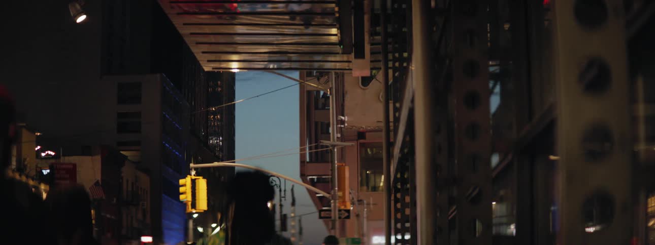 Reflection of pedestrians walking down street