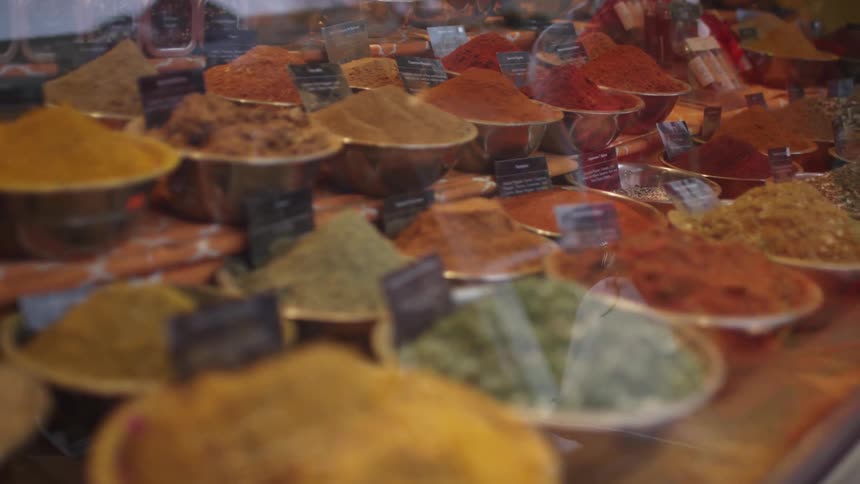 A display case showcasing a number of spices