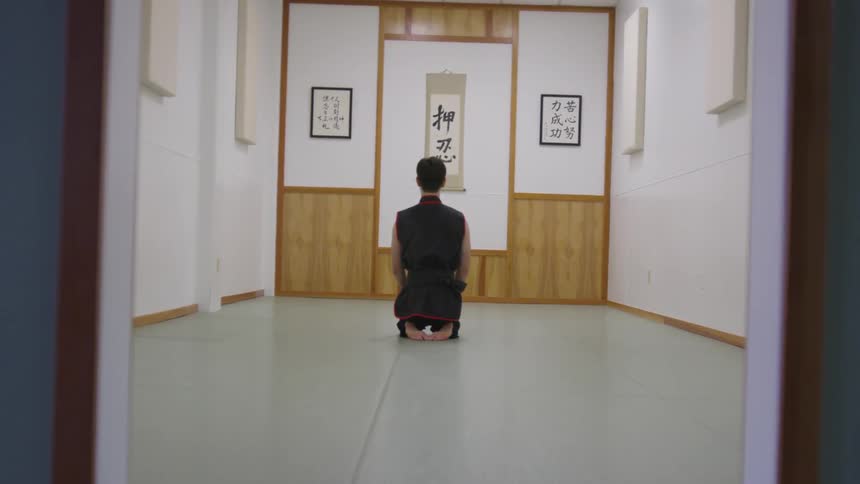 Man Practicing Asian Fighting Techniques