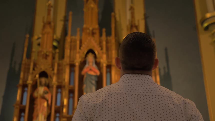 Man Praying At Church