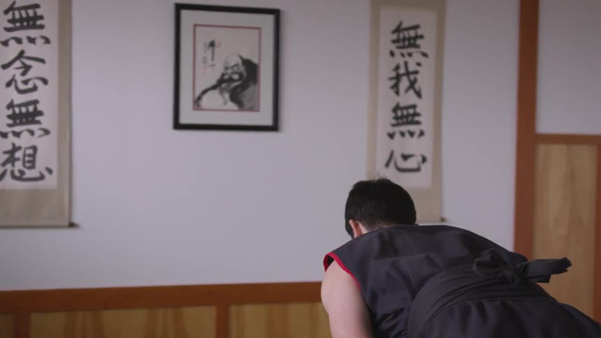 Man Practicing Asian Fighting Techniques