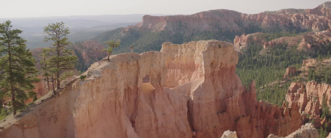 Woman Taking Photos And Exploring Overlook