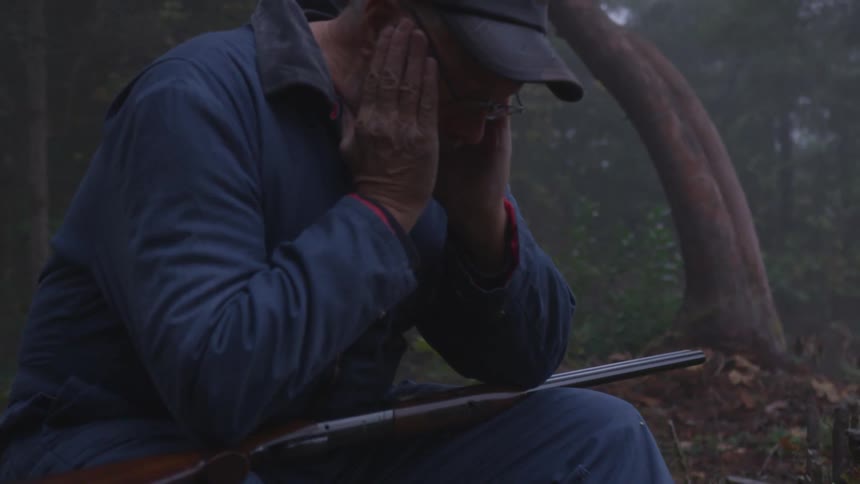 Man In Forest With Weapons
