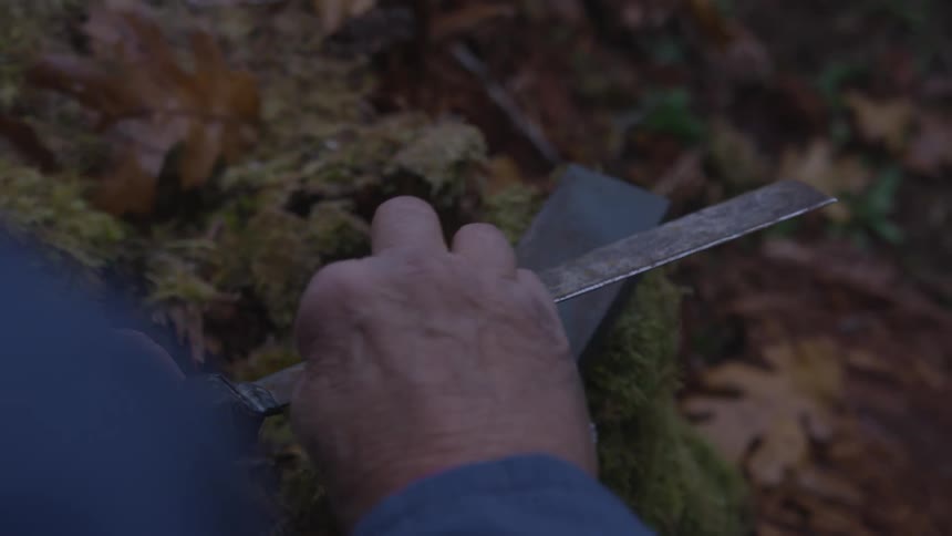 Man In Forest With Weapons