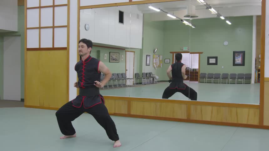 Man Practicing Asian Fighting Techniques
