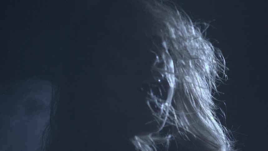 A person face covered with hair