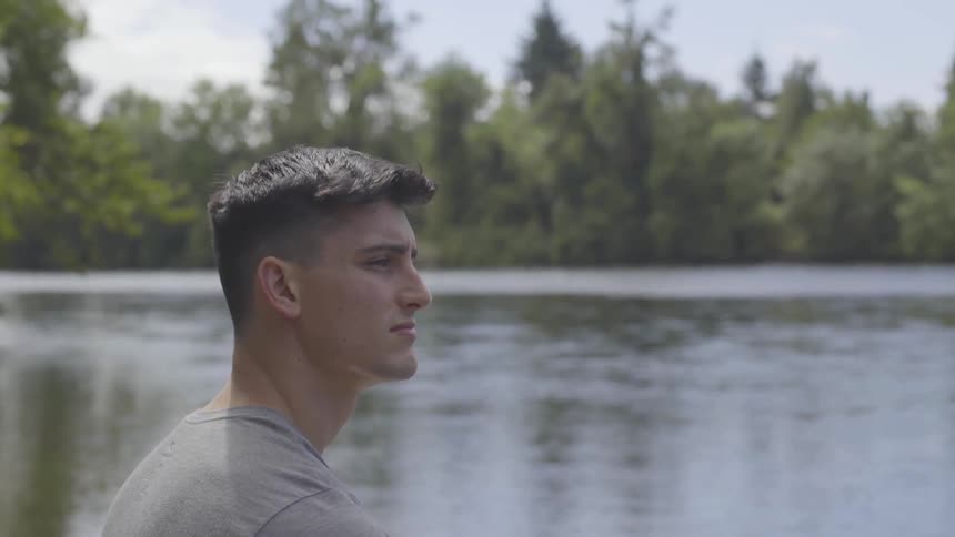 Man Sitting By A River