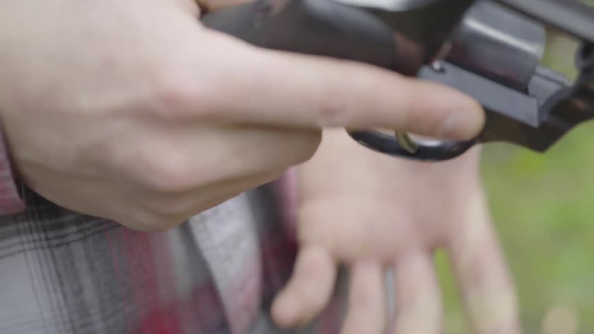 Man Shooting Guns Outside