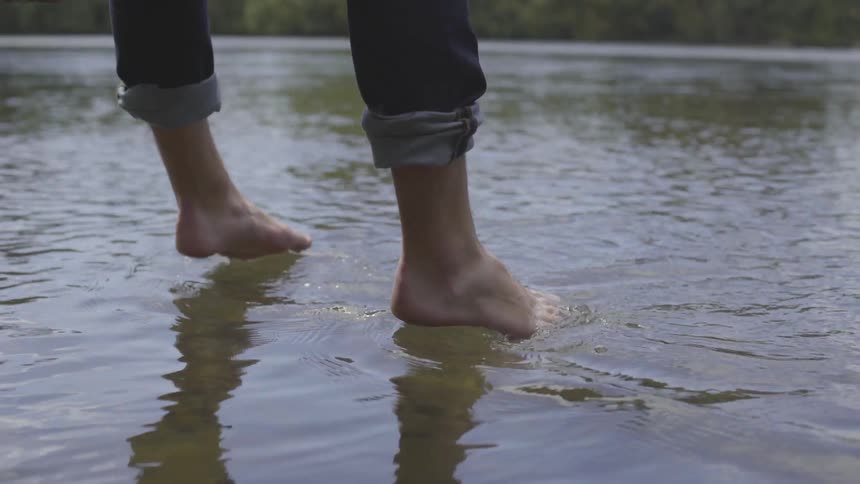 Man Sitting By A River