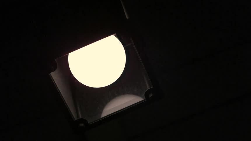 A light bulb in a housing unit